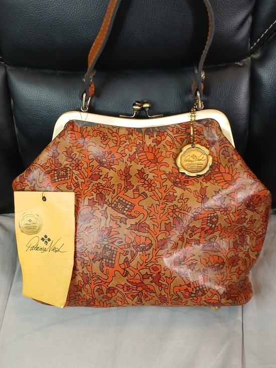 Patricia Nash Handbags - Patricia Nash 10th Anniversary Kisslock Satchel in Orange Brown